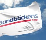 Sandbäckens logotyp på en flagga. Foto: Sandbäckens