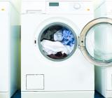Tvättmaskiner med tvätt i. Foto: Colourbox