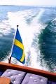 Svenskflaggad motorbåt i Öresund. Foto: Colorbox